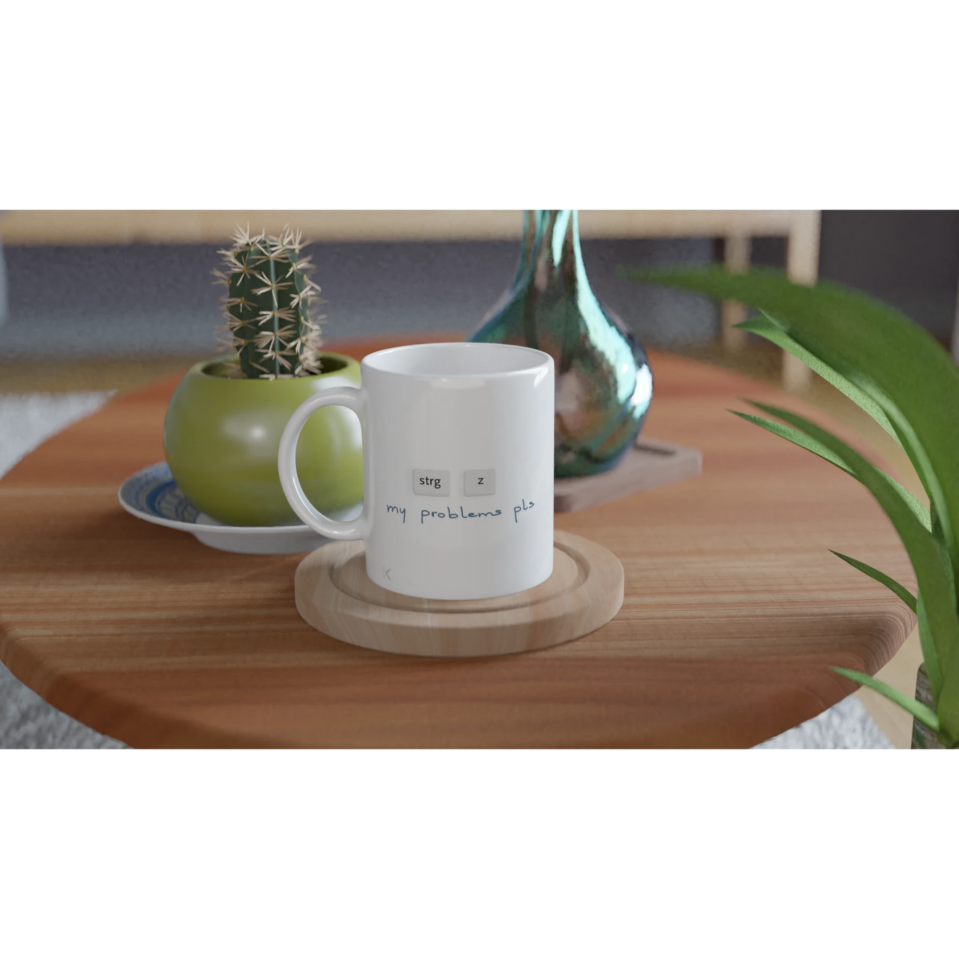 Eine Tasse mit der Aufschrift "strg z my problems pls"