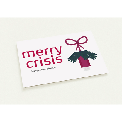 Horizontale Weihnachtskarten auf denen steht "Merry Crisis - hope you have a backup". Daneben ein illustrierter USB Stick an einer Schnur, mit Tannenzweigen.
